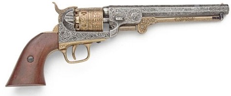 1851 Navy revolver. nickel and brass, wood grips.